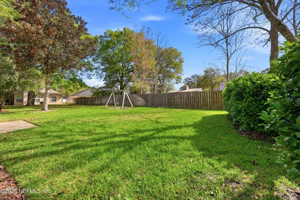 a view of garden with trees