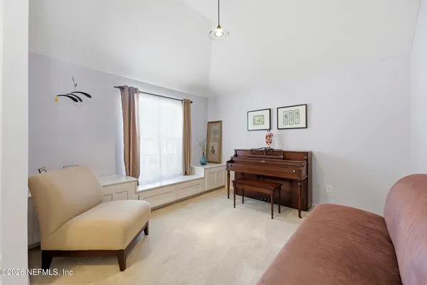 a living room with furniture and a window