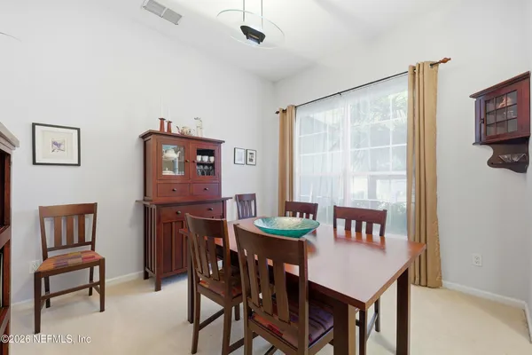 a view of a dining room with furniture