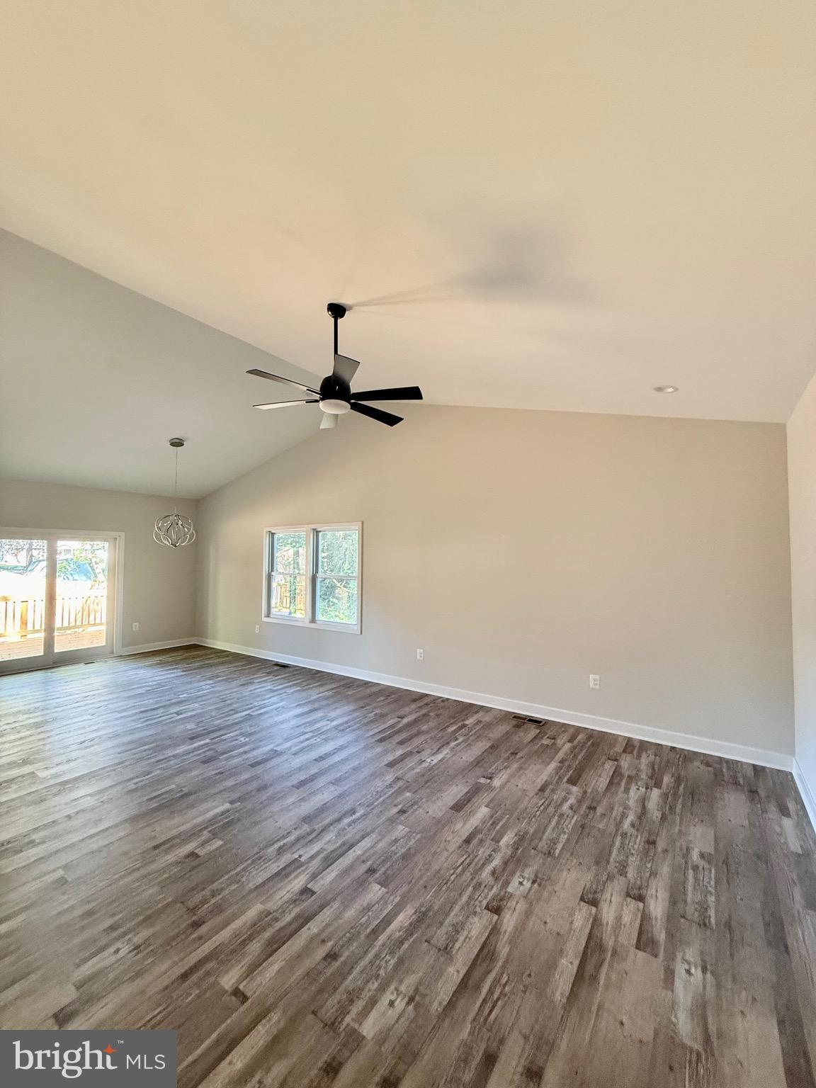 228 Dale Drive Colonial Beach, VA 22443 - Photo 11 of 59 an empty room with wooden floor and windows