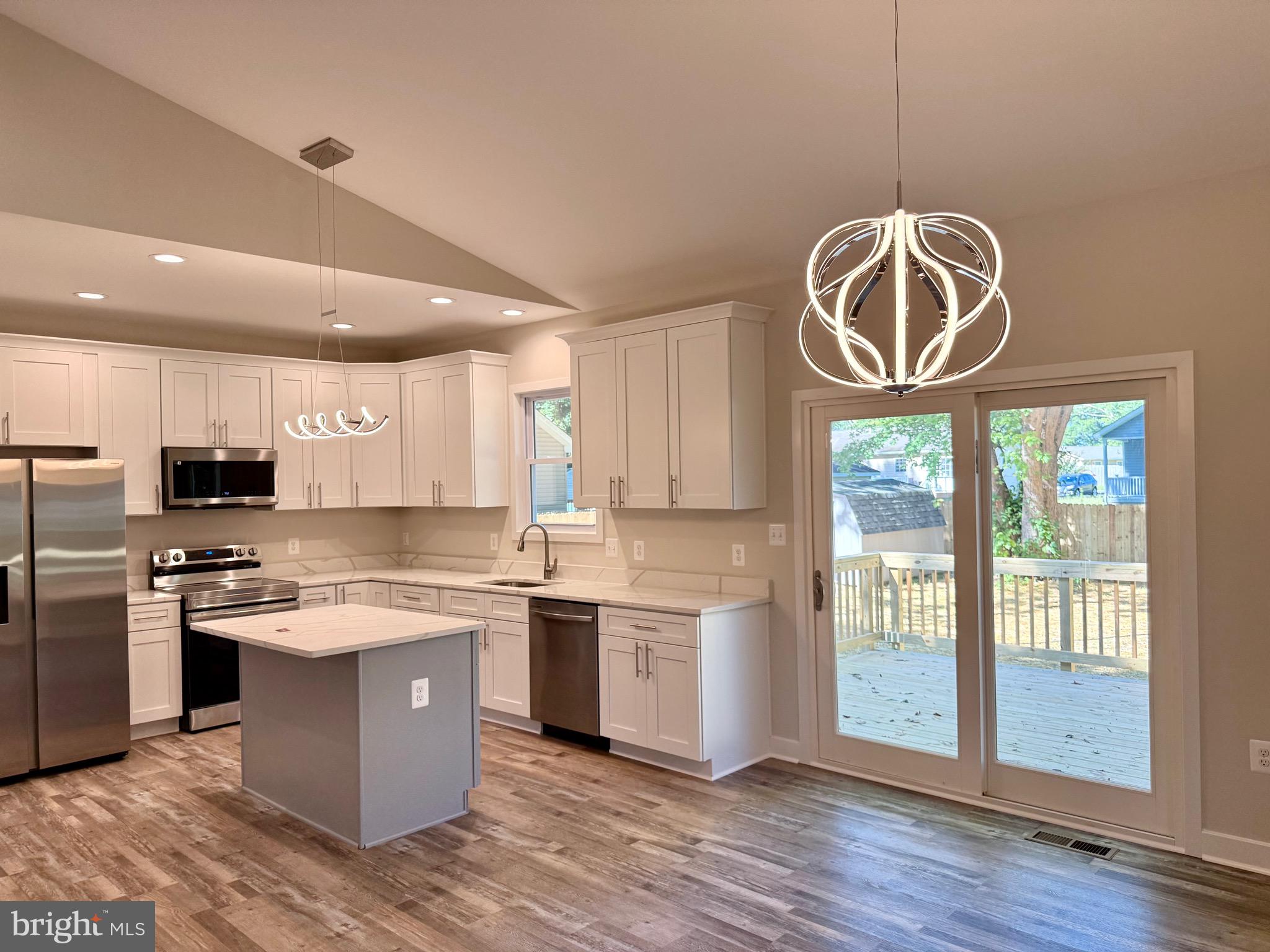 228 Dale Drive Colonial Beach, VA 22443 - Photo 12 of 59 a kitchen with a stove a refrigerator and a sink