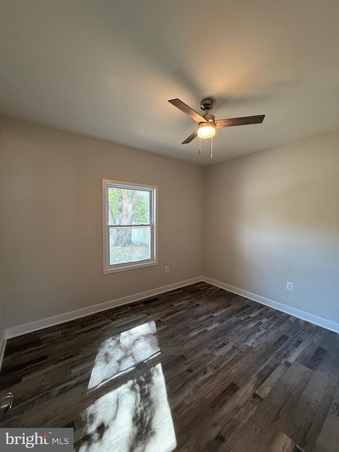 228 Dale Drive Colonial Beach, VA 22443 - Photo 23 of 59 wooden floor in an empty room with a window