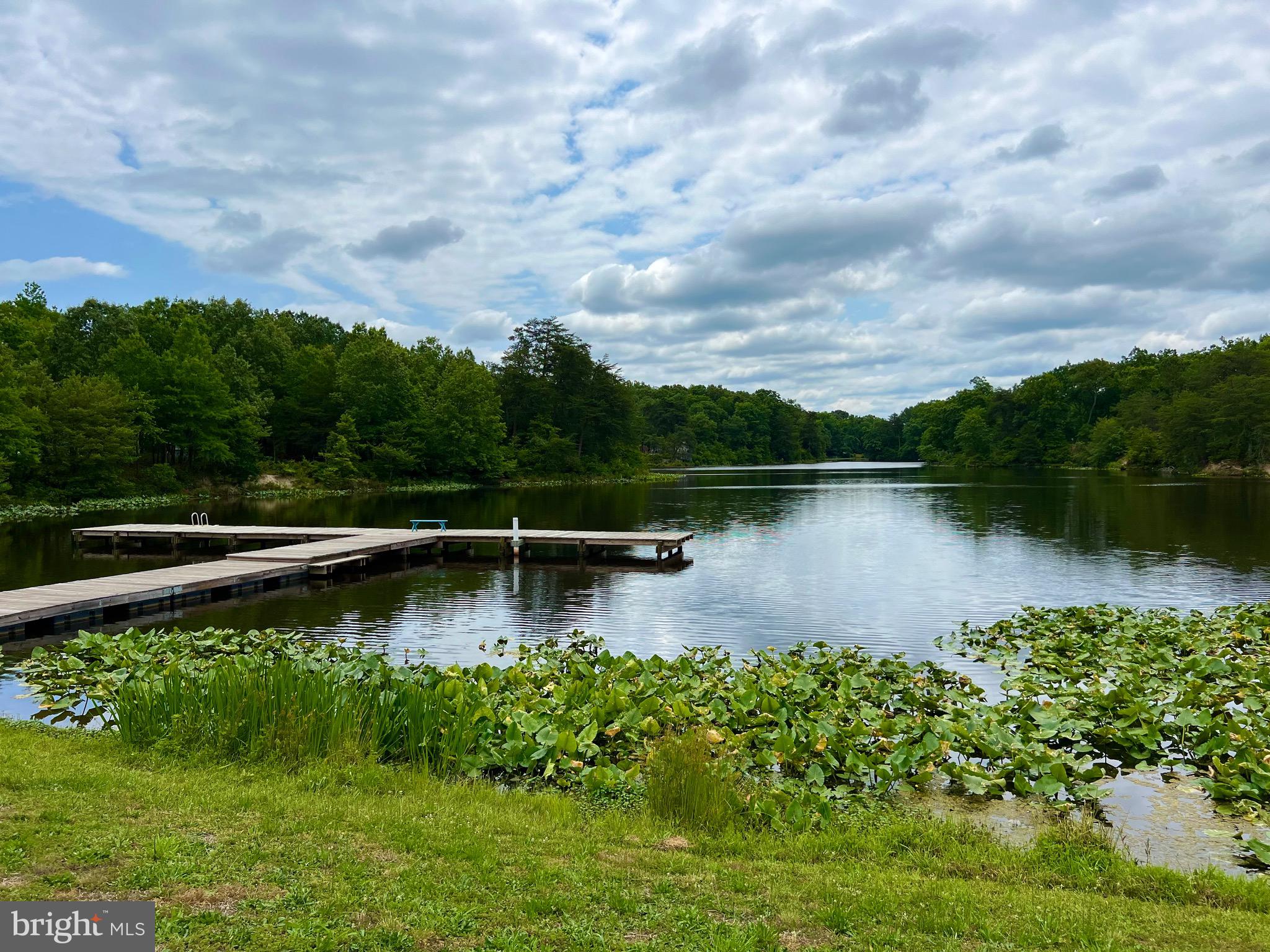 228 Dale Drive Colonial Beach, VA 22443 - Photo 39 of 59 a view of a lake with a house in the background