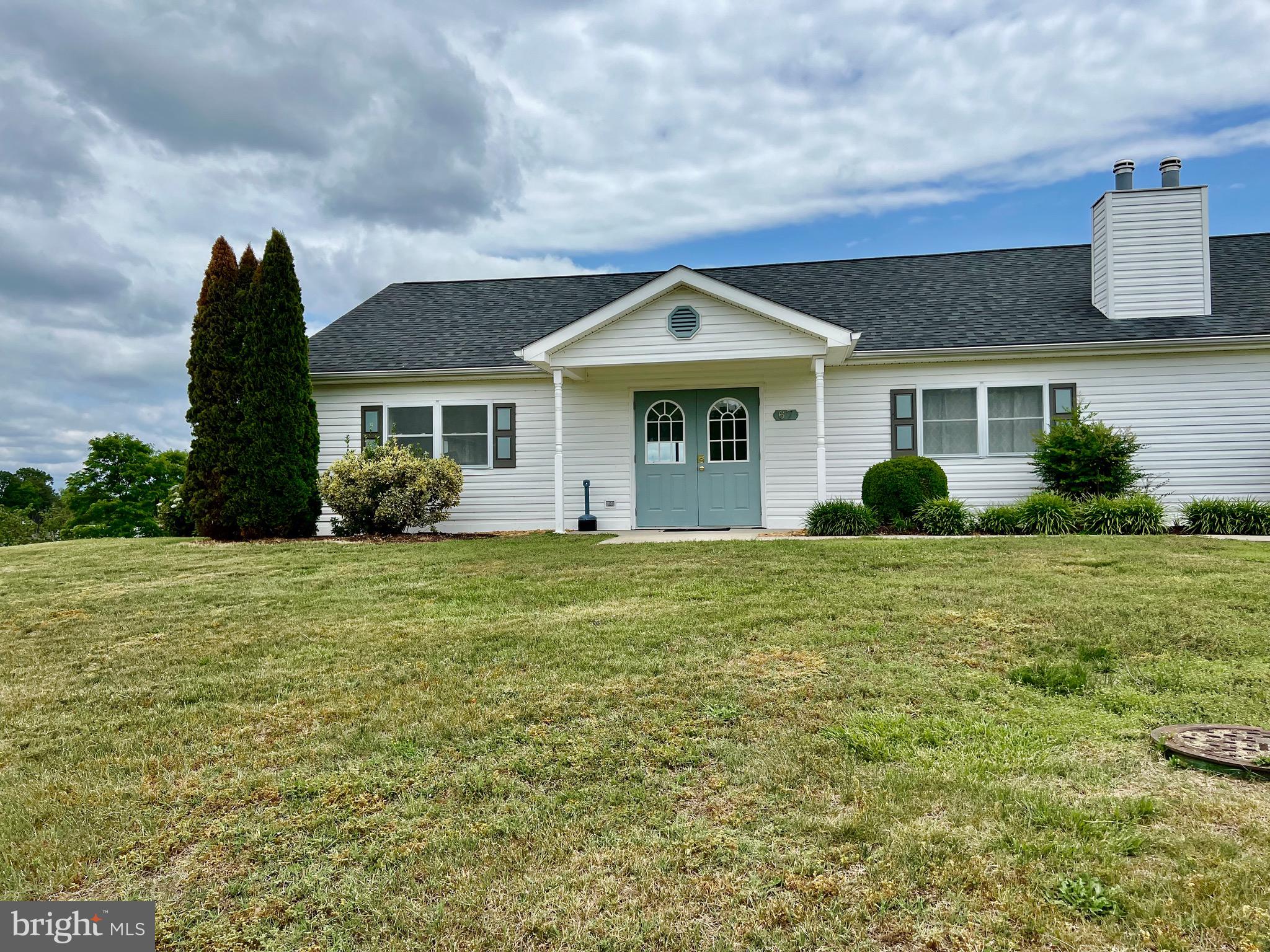 228 Dale Drive Colonial Beach, VA 22443 - Photo 52 of 59 a front view of a house with garden