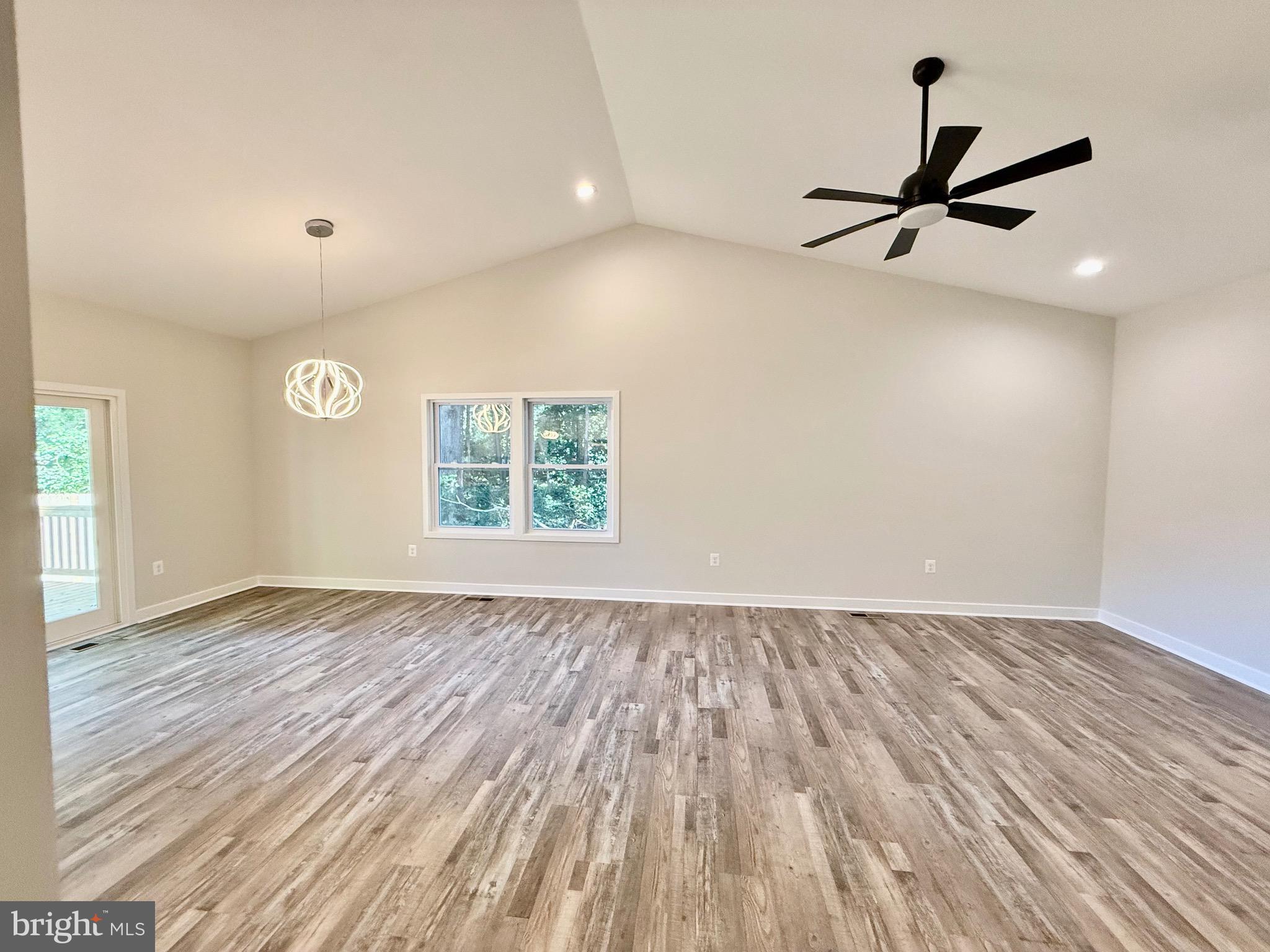 228 Dale Drive Colonial Beach, VA 22443 - Photo 7 of 59 wooden floor in an empty room with a window