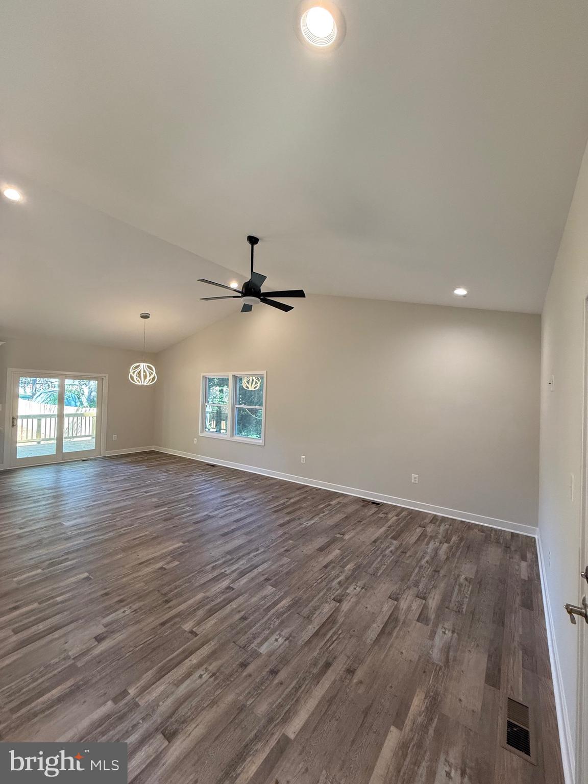 228 Dale Drive Colonial Beach, VA 22443 - Photo 10 of 59 an empty room with wooden floor and windows