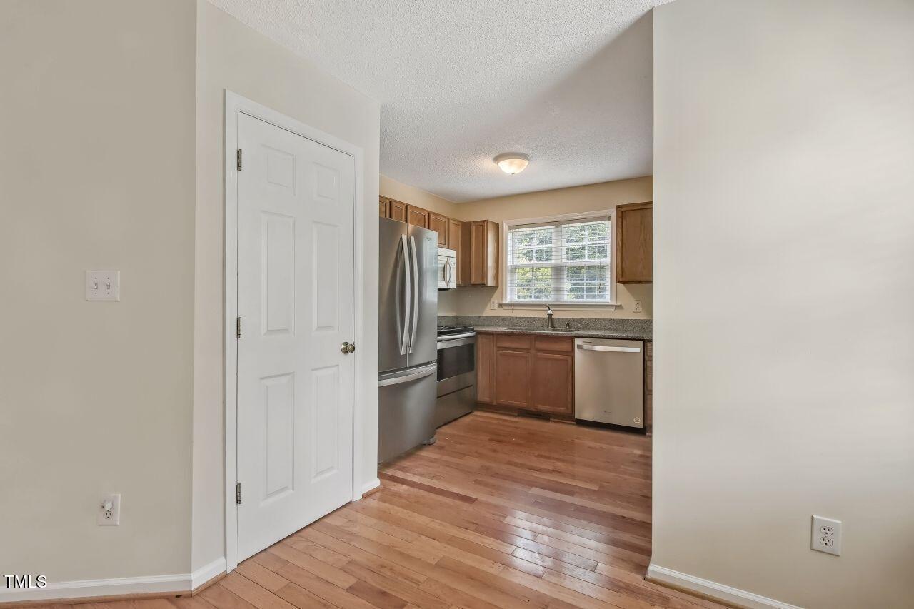 100 Bryant Drive Smithfield, NC 27577 - Photo 12 of 34 a kitchen with a refrigerator sink and cabinets