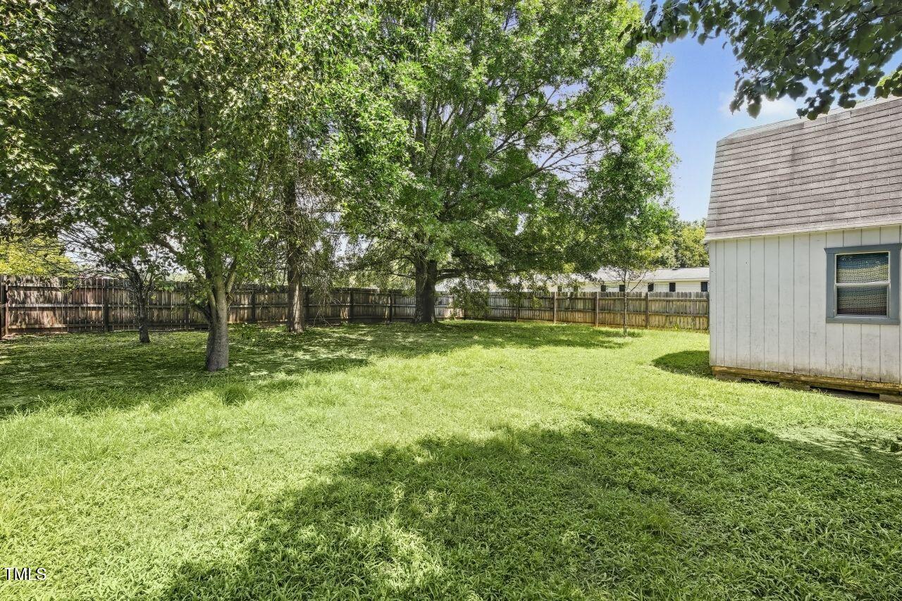100 Bryant Drive Smithfield, NC 27577 - Photo 27 of 34 a view of a backyard with a garden