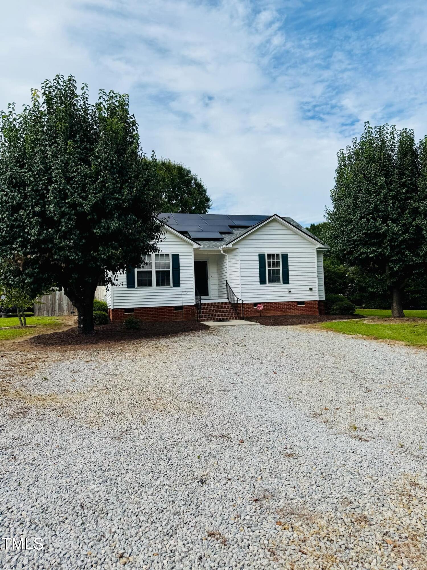 100 Bryant Drive Smithfield, NC 27577 - Photo 3 of 34 a house with trees in the background