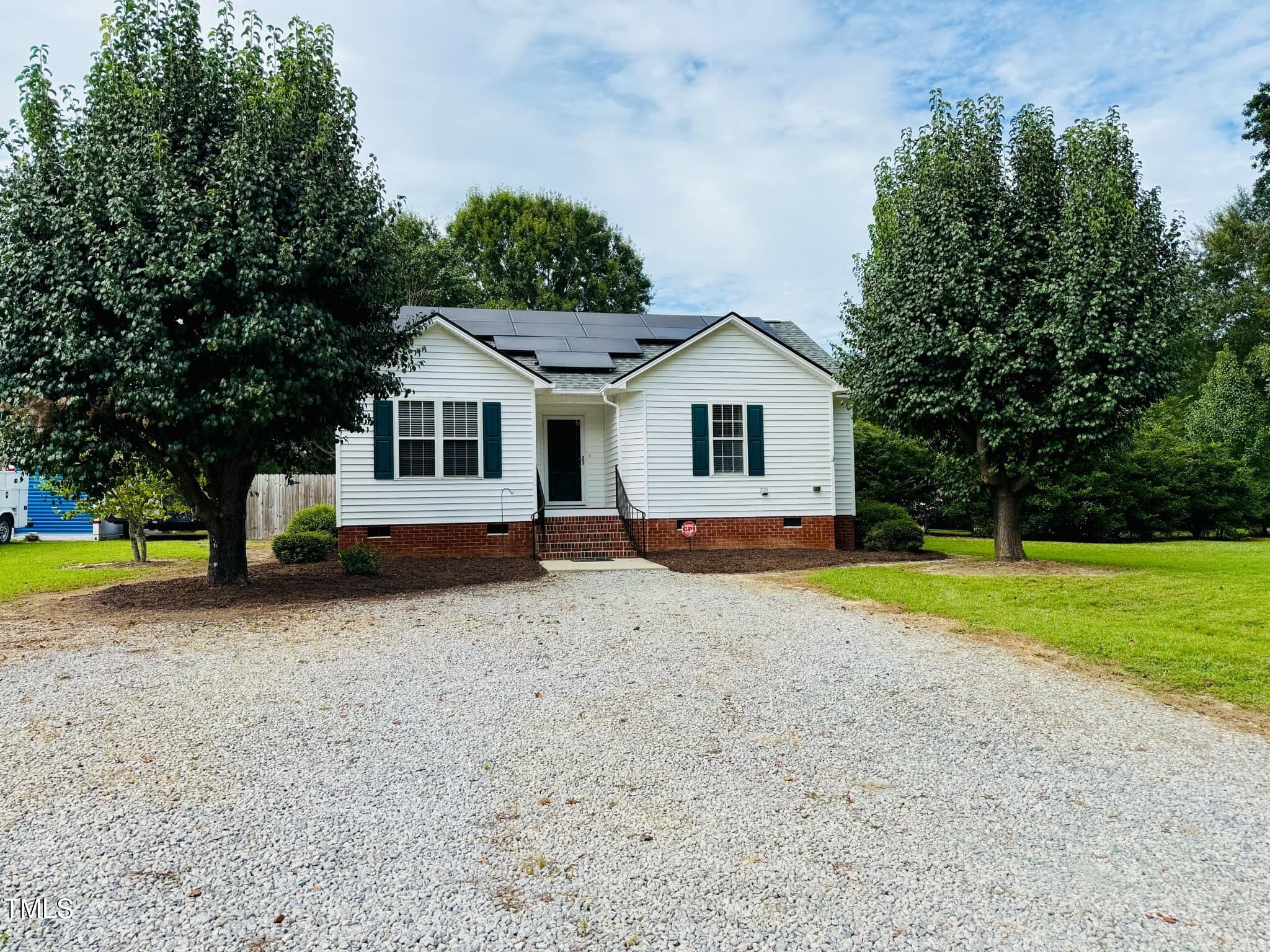 100 Bryant Drive Smithfield, NC 27577 - Photo 4 of 34 a house with trees in the background