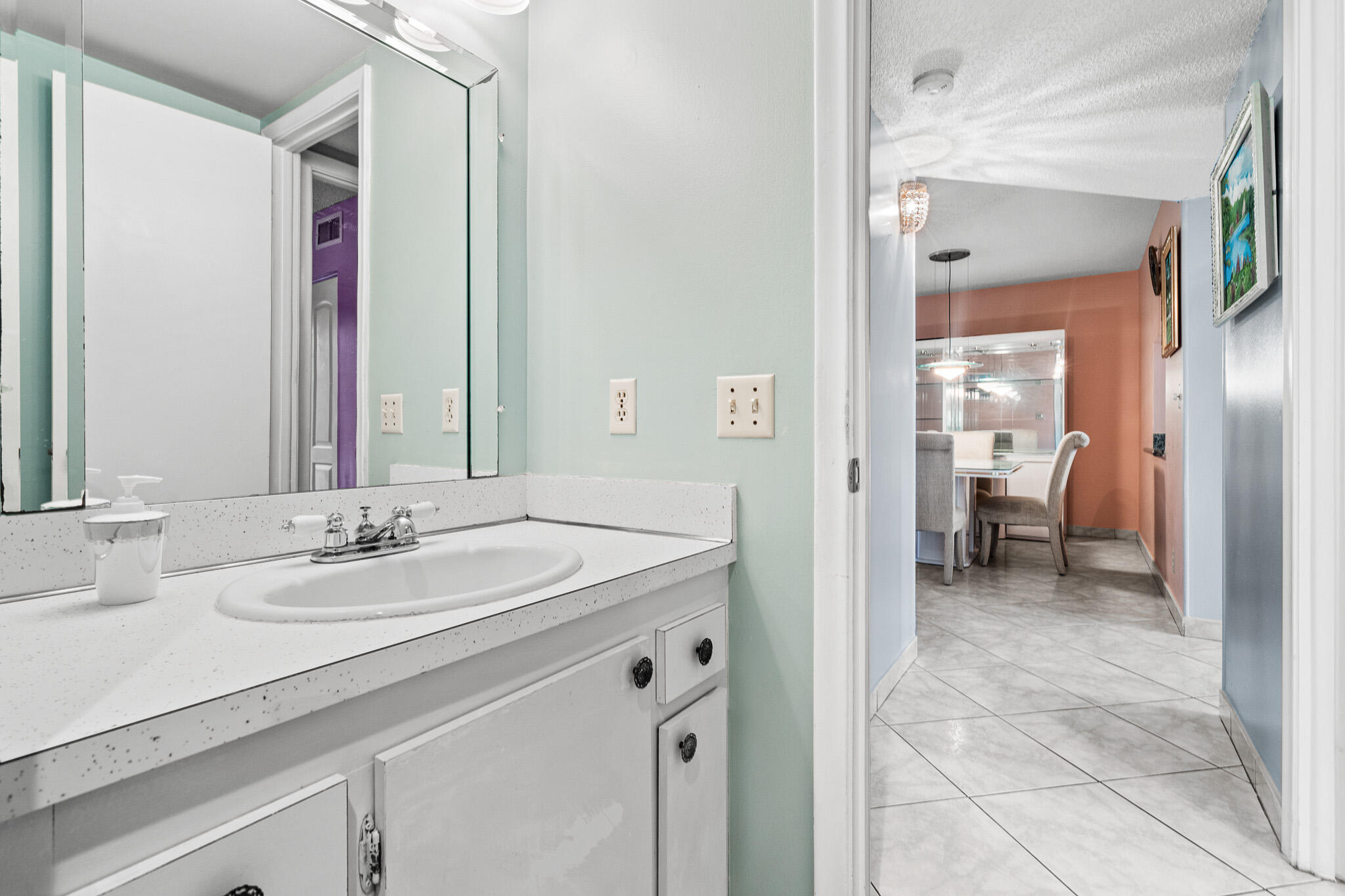 250 Northeast 20th Street, Unit 1290 Boca Raton, FL 33431 - Photo 21 of 41 a en suite bathroom with a sink and a mirror