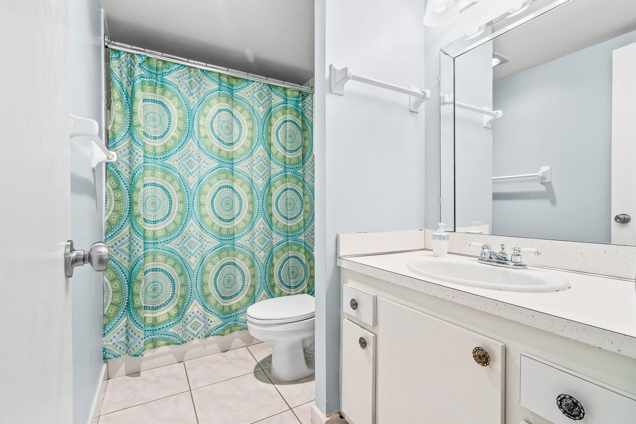 250 Northeast 20th Street, Unit 1290 Boca Raton, FL 33431 - Photo 22 of 41 a bathroom with a granite countertop sink and a mirror