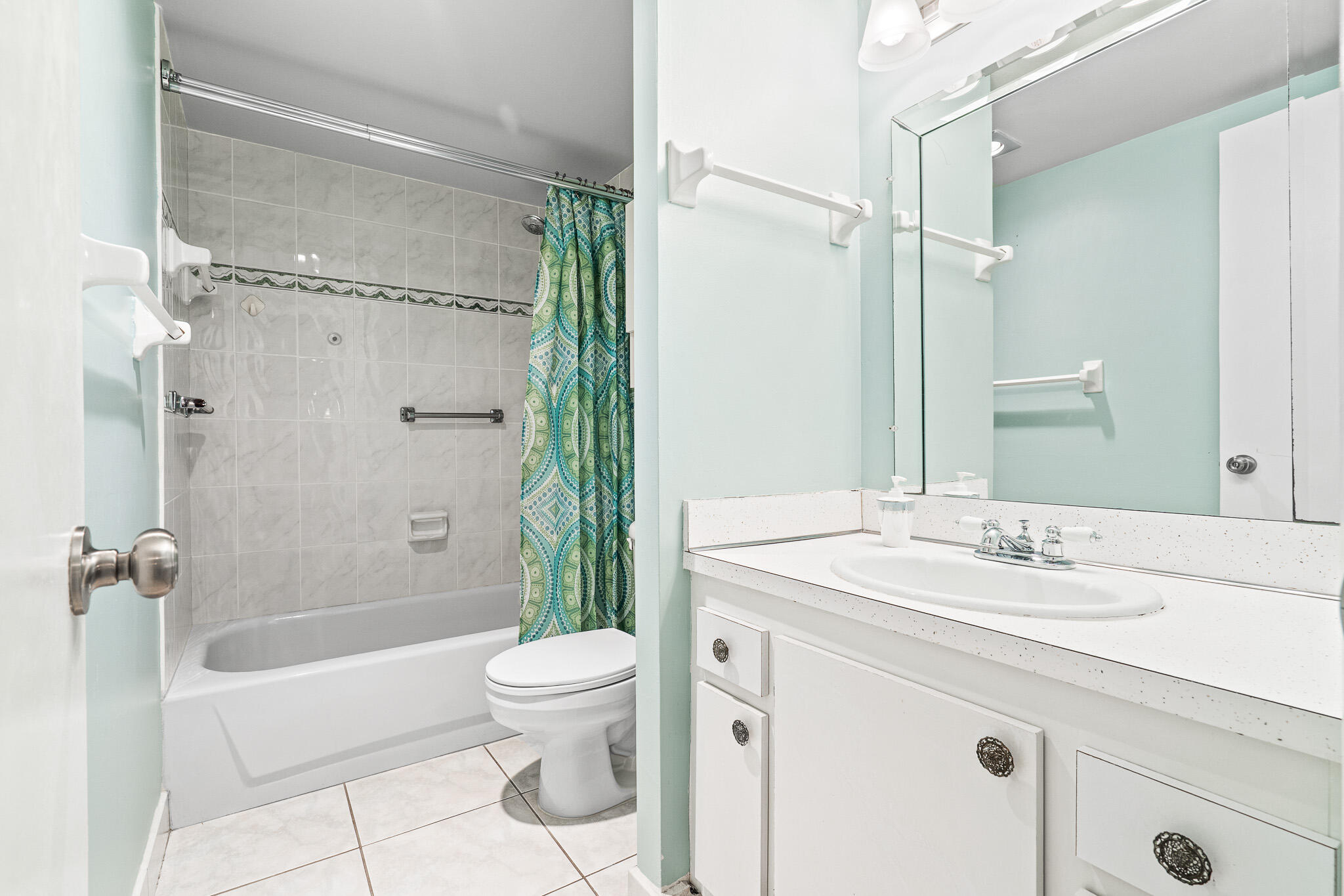 250 Northeast 20th Street, Unit 1290 Boca Raton, FL 33431 - Photo 23 of 41 a bathroom with a sink toilet and shower