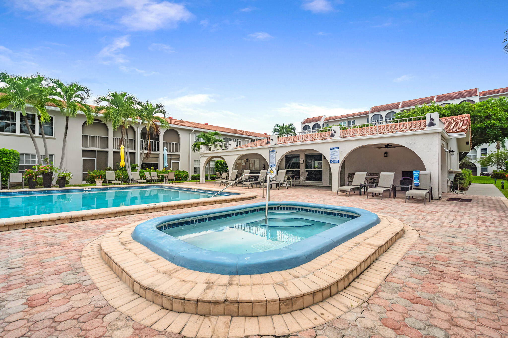 250 Northeast 20th Street, Unit 1290 Boca Raton, FL 33431 - Photo 29 of 41 a view of a house with swimming pool and a sitting space