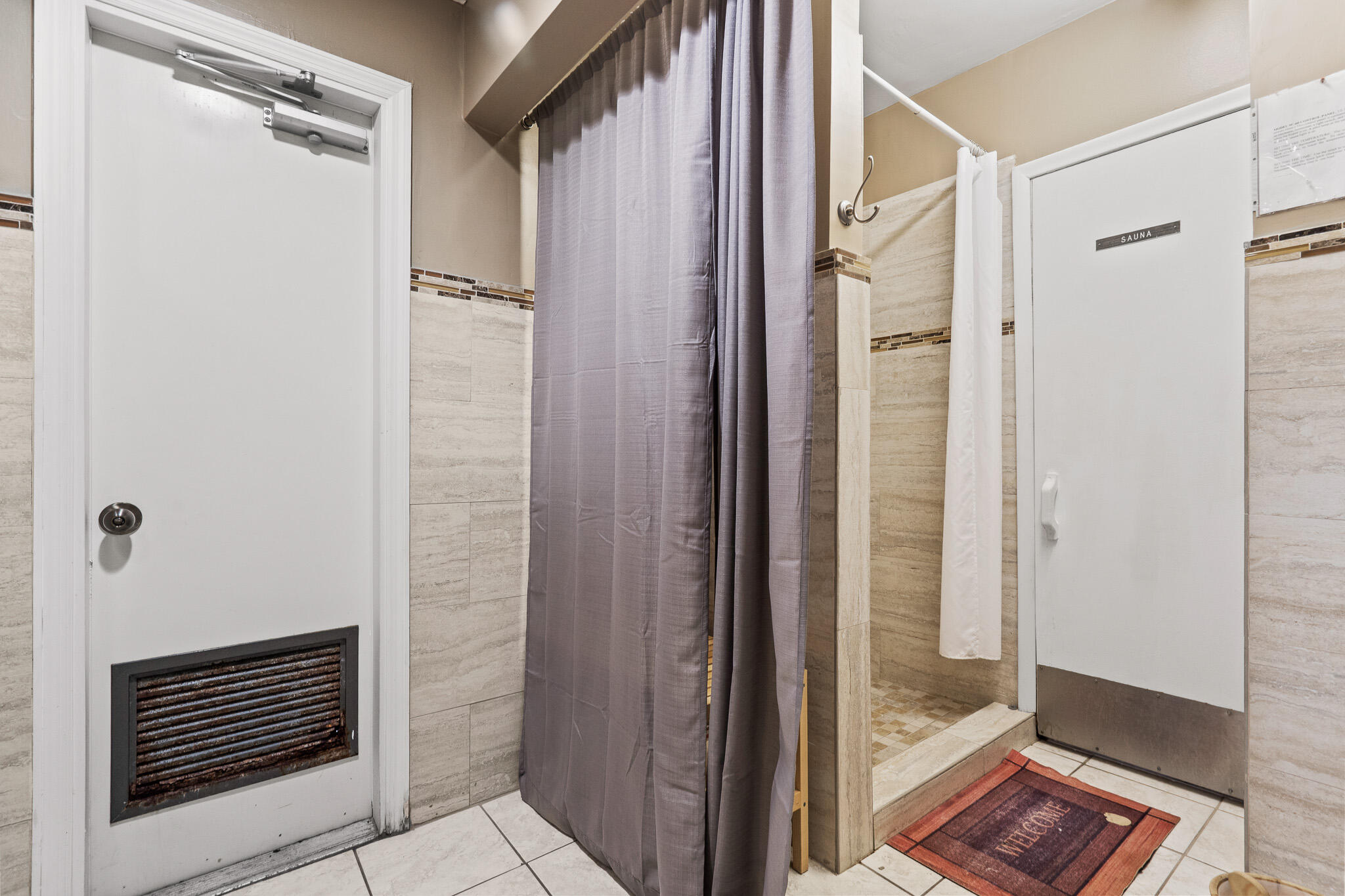 250 Northeast 20th Street, Unit 1290 Boca Raton, FL 33431 - Photo 36 of 41 a bathroom with a glass shower door
