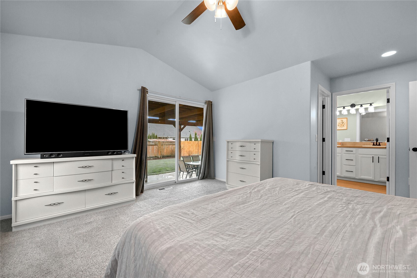 405 Jackson Court Nooksack, WA 98276 - Photo 14 of 28 a bedroom with a bed and a flat screen tv