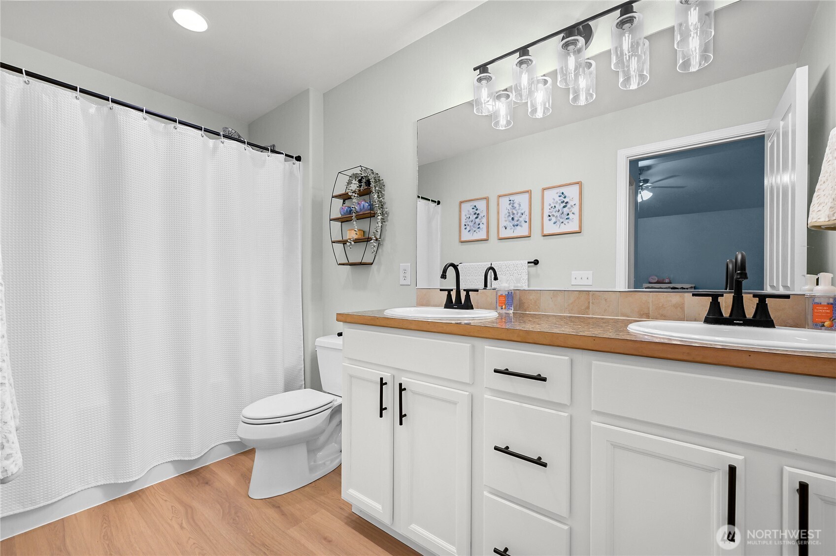 405 Jackson Court Nooksack, WA 98276 - Photo 15 of 28 a spacious bathroom with a toilet a sink and a large mirror