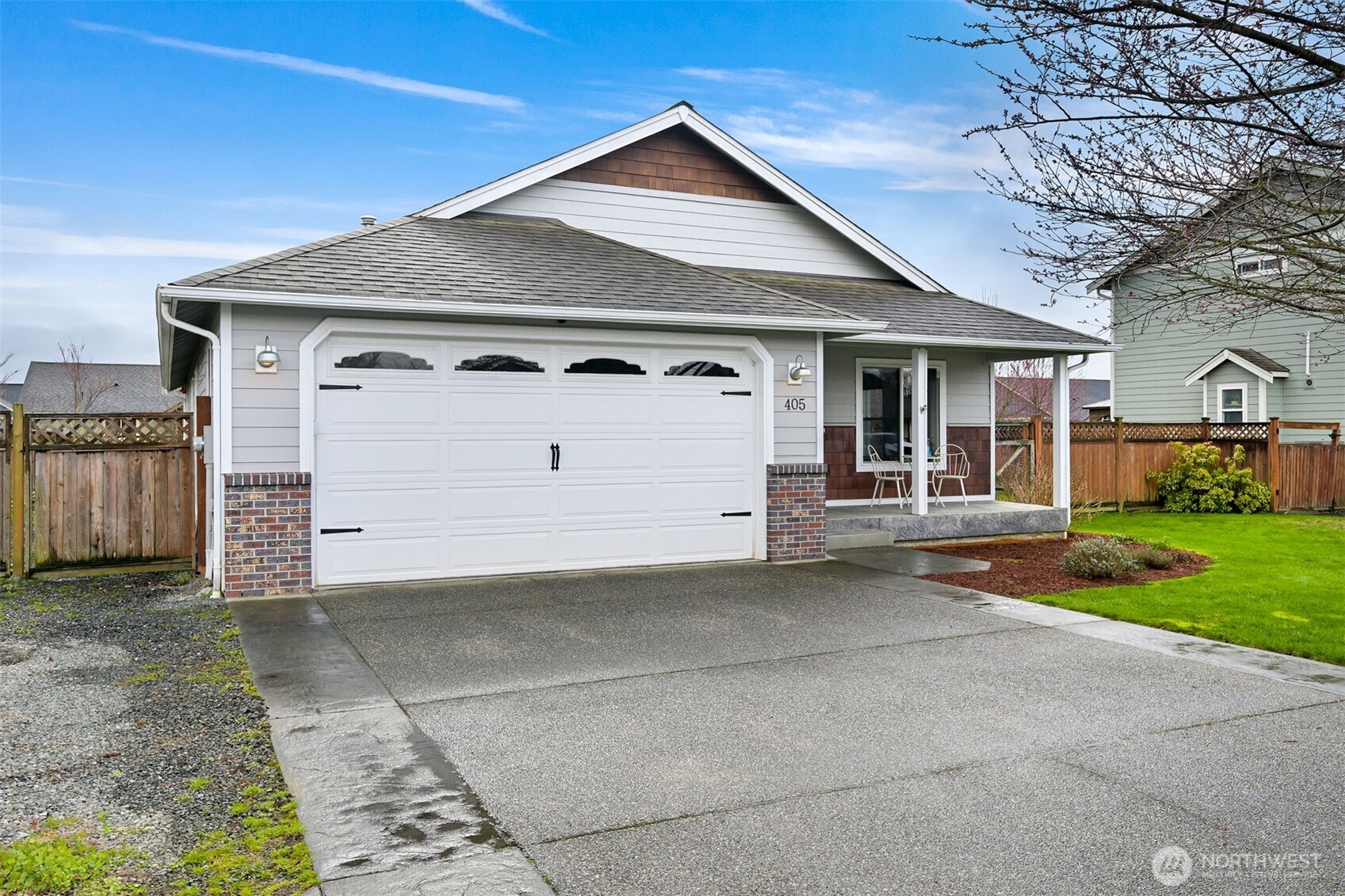405 Jackson Court Nooksack, WA 98276 - Photo 2 of 28 a view of a house with a yard and garage