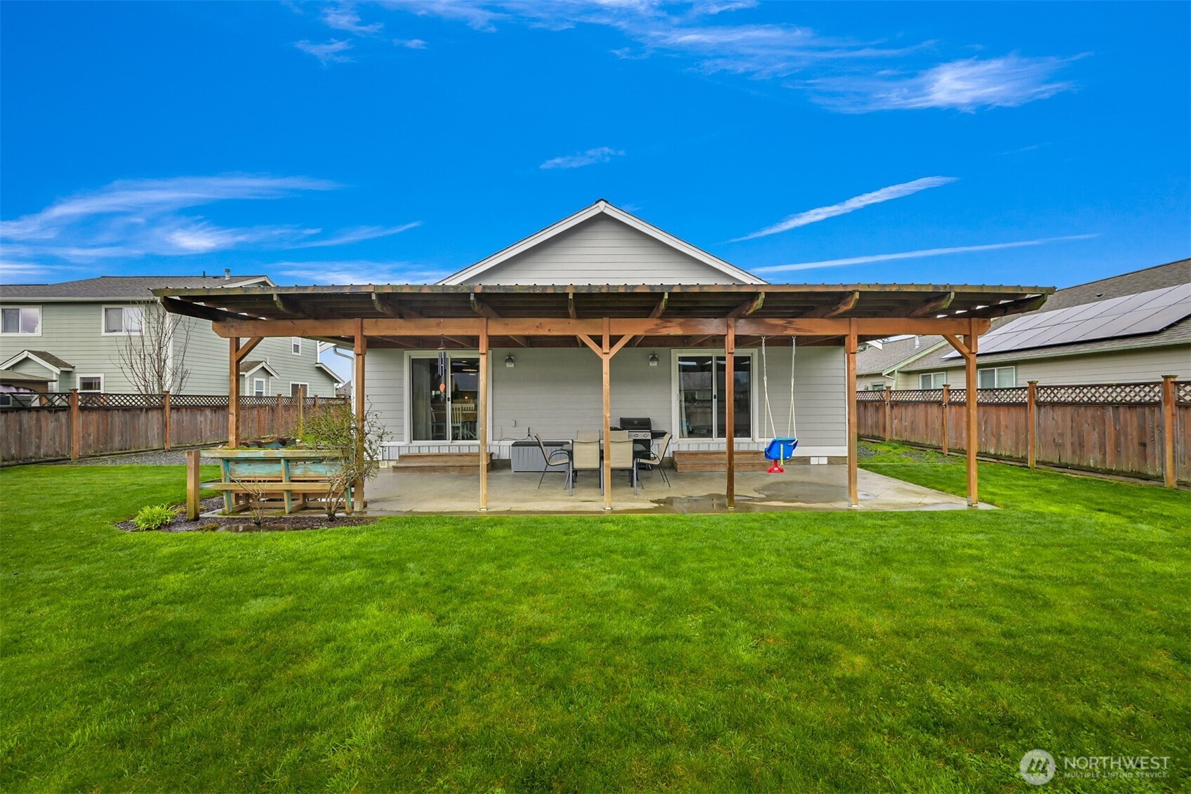 405 Jackson Court Nooksack, WA 98276 - Photo 23 of 28 a view of a house with a yard and sitting area