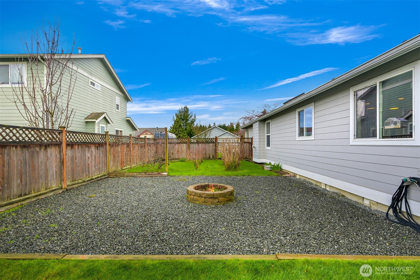 405 Jackson Court Nooksack, WA 98276 - Photo 25 of 28 a view of backyard with wooden fence
