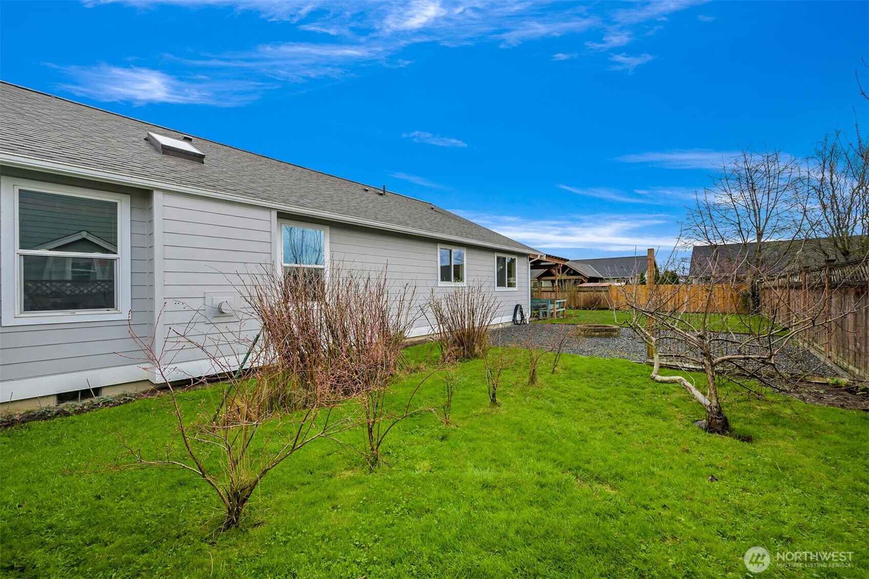 405 Jackson Court Nooksack, WA 98276 - Photo 26 of 28 a backyard of a house with table and chairs