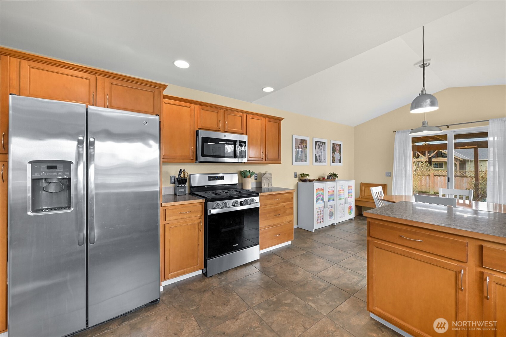 405 Jackson Court Nooksack, WA 98276 - Photo 9 of 28 a kitchen with stainless steel appliances granite countertop a refrigerator a stove top oven a sink and dishwasher