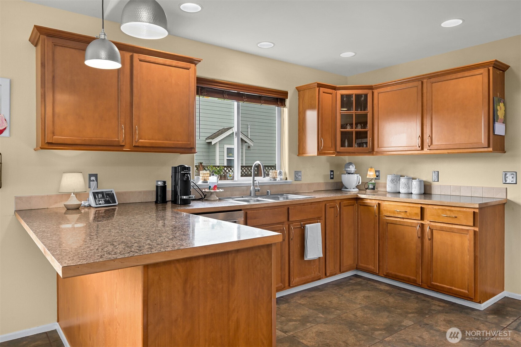 405 Jackson Court Nooksack, WA 98276 - Photo 10 of 28 a kitchen with stainless steel appliances granite countertop a sink stove and cabinets
