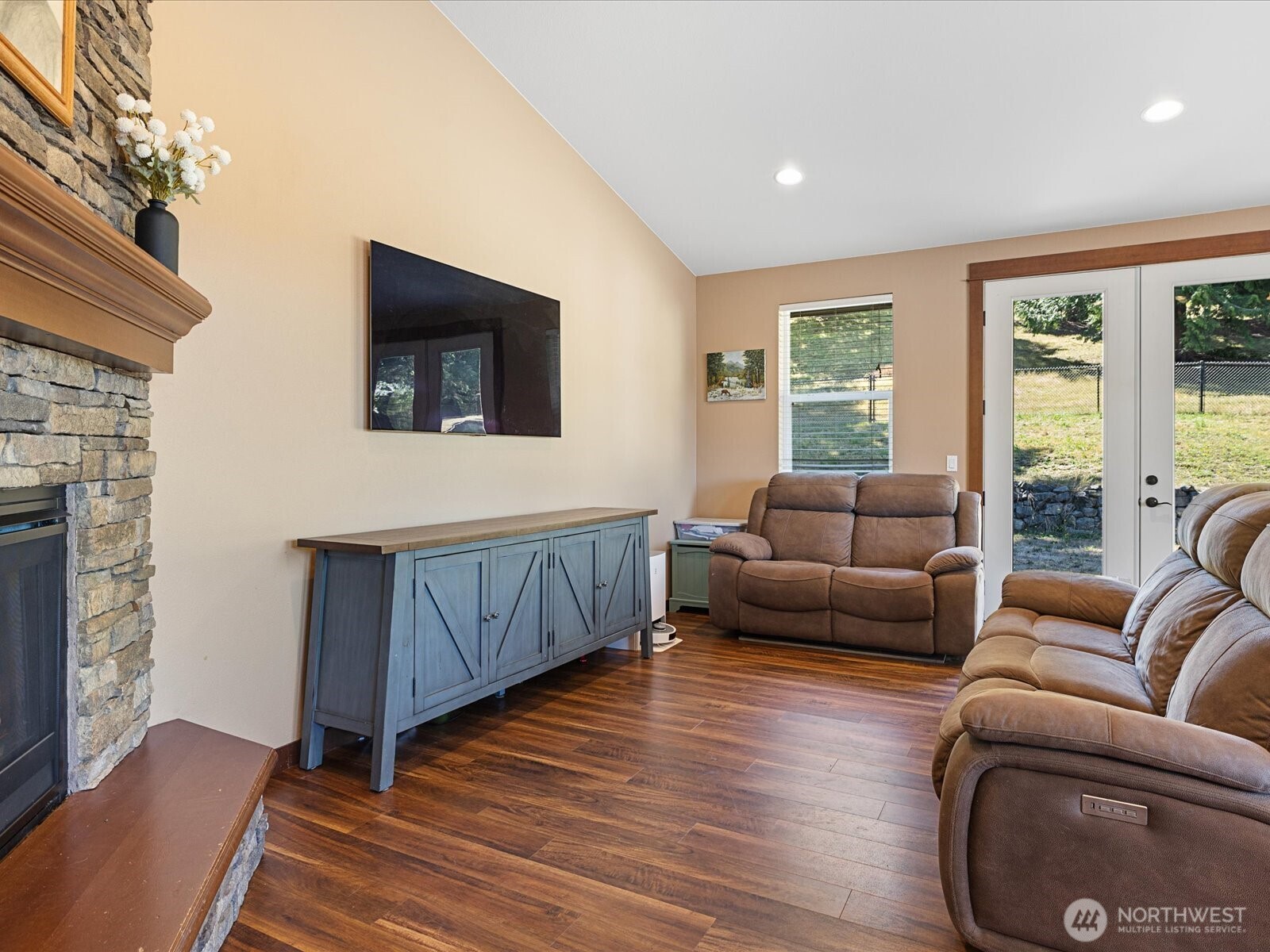 606 288th Street East Roy, WA 98580 - Photo 16 of 37 a living room with furniture and a flat screen tv