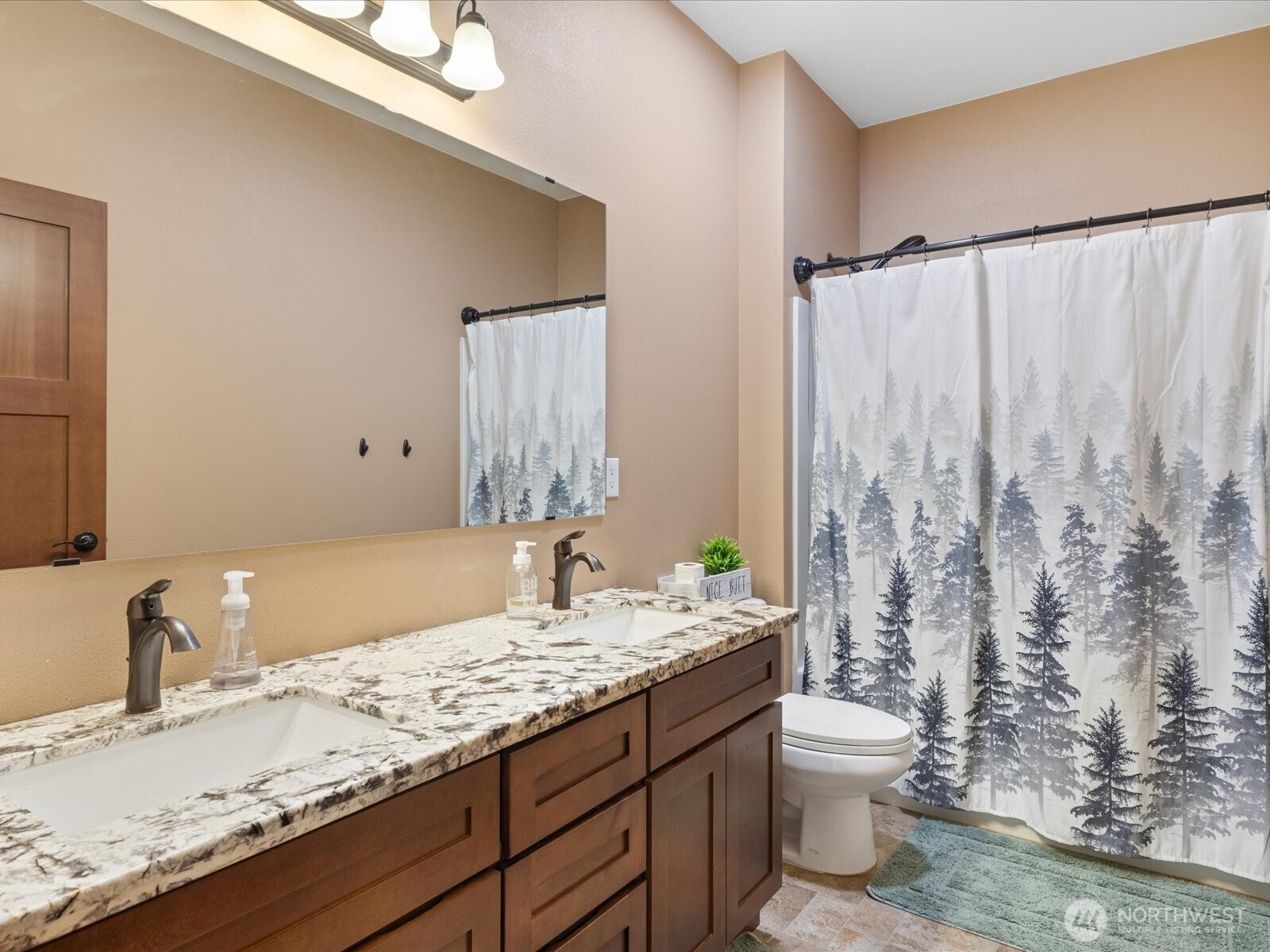 606 288th Street East Roy, WA 98580 - Photo 25 of 37 a bathroom with a granite countertop sink and a mirror