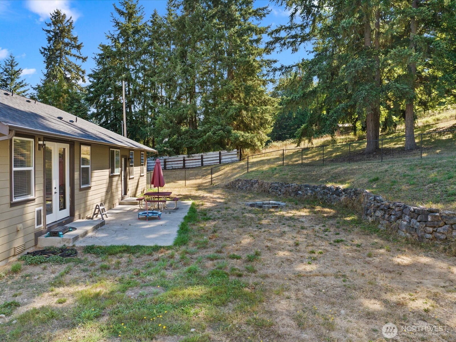 606 288th Street East Roy, WA 98580 - Photo 29 of 37 a view of backyard with deck and garden