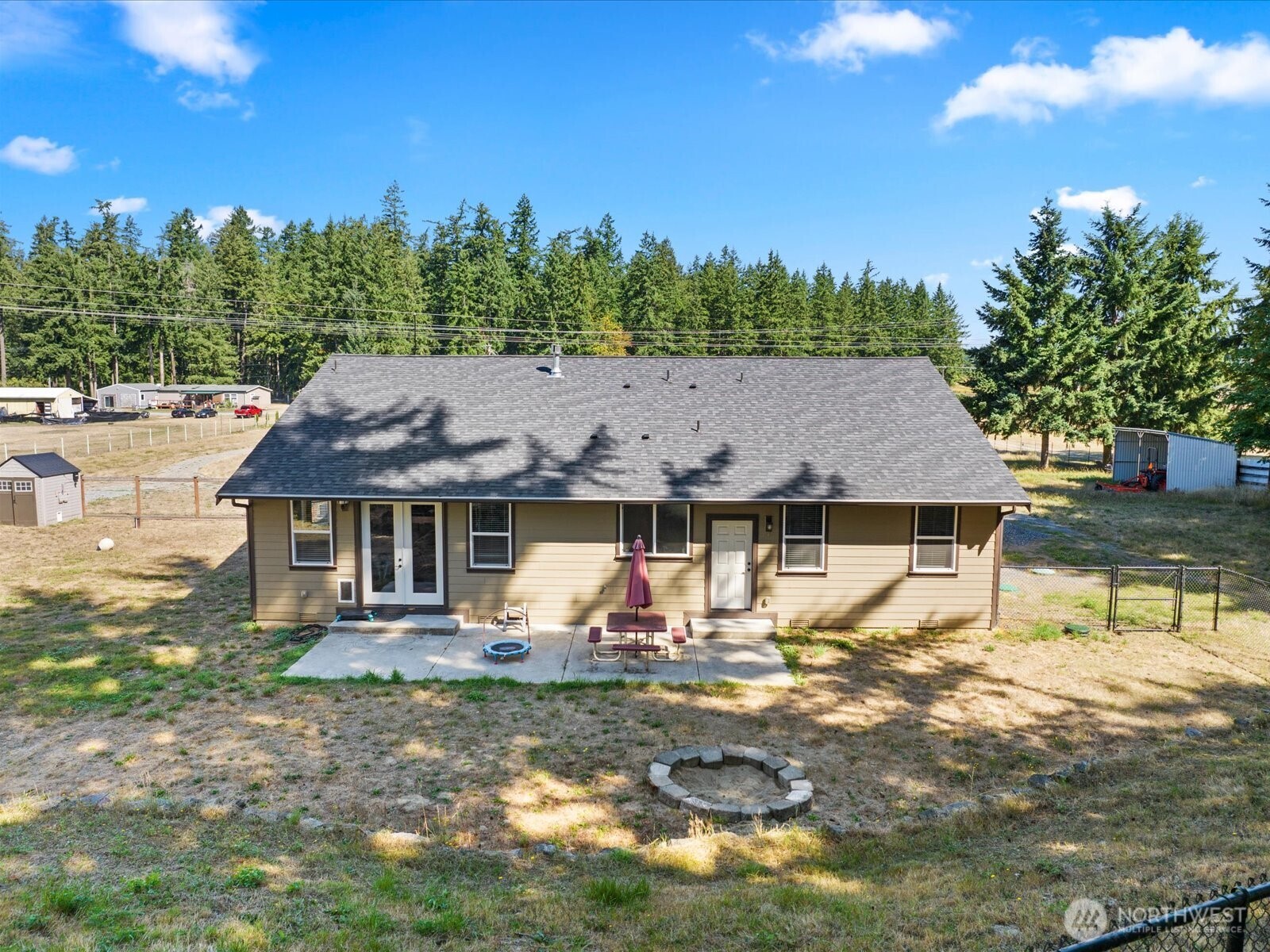 606 288th Street East Roy, WA 98580 - Photo 30 of 37 a front view of a house with garden