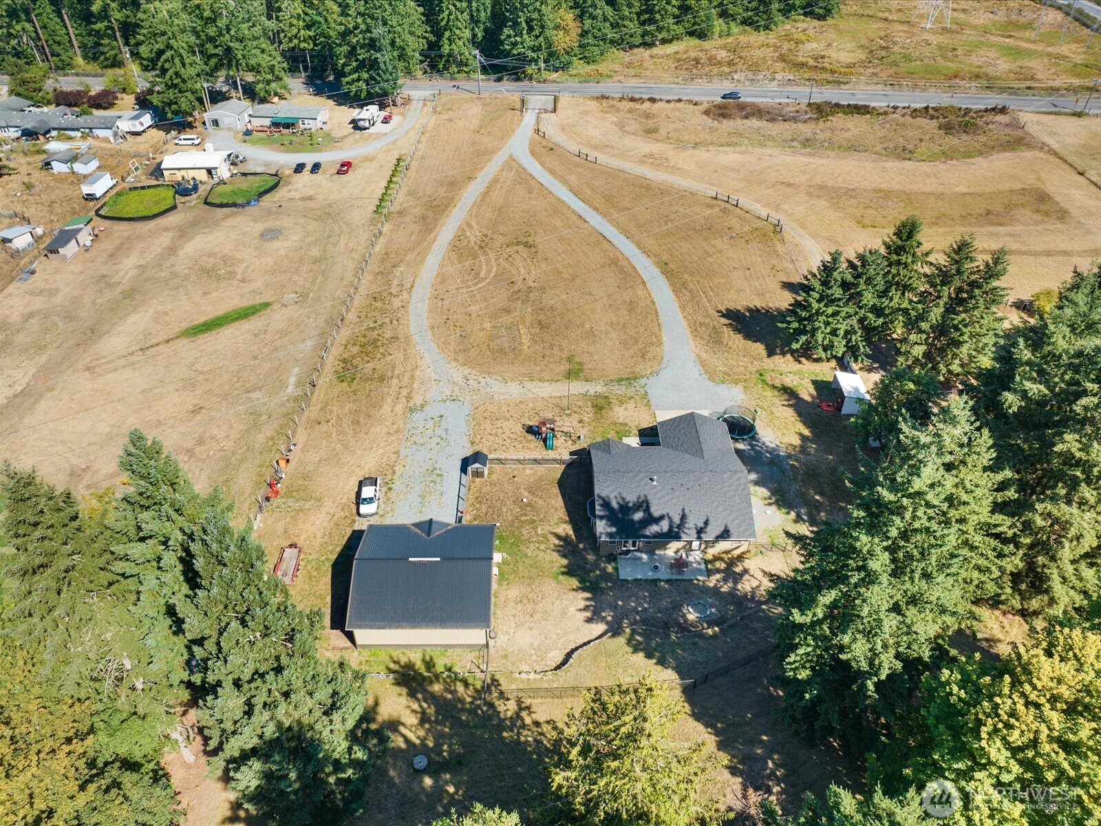 606 288th Street East Roy, WA 98580 - Photo 31 of 37 an aerial view of a house with a swimming pool