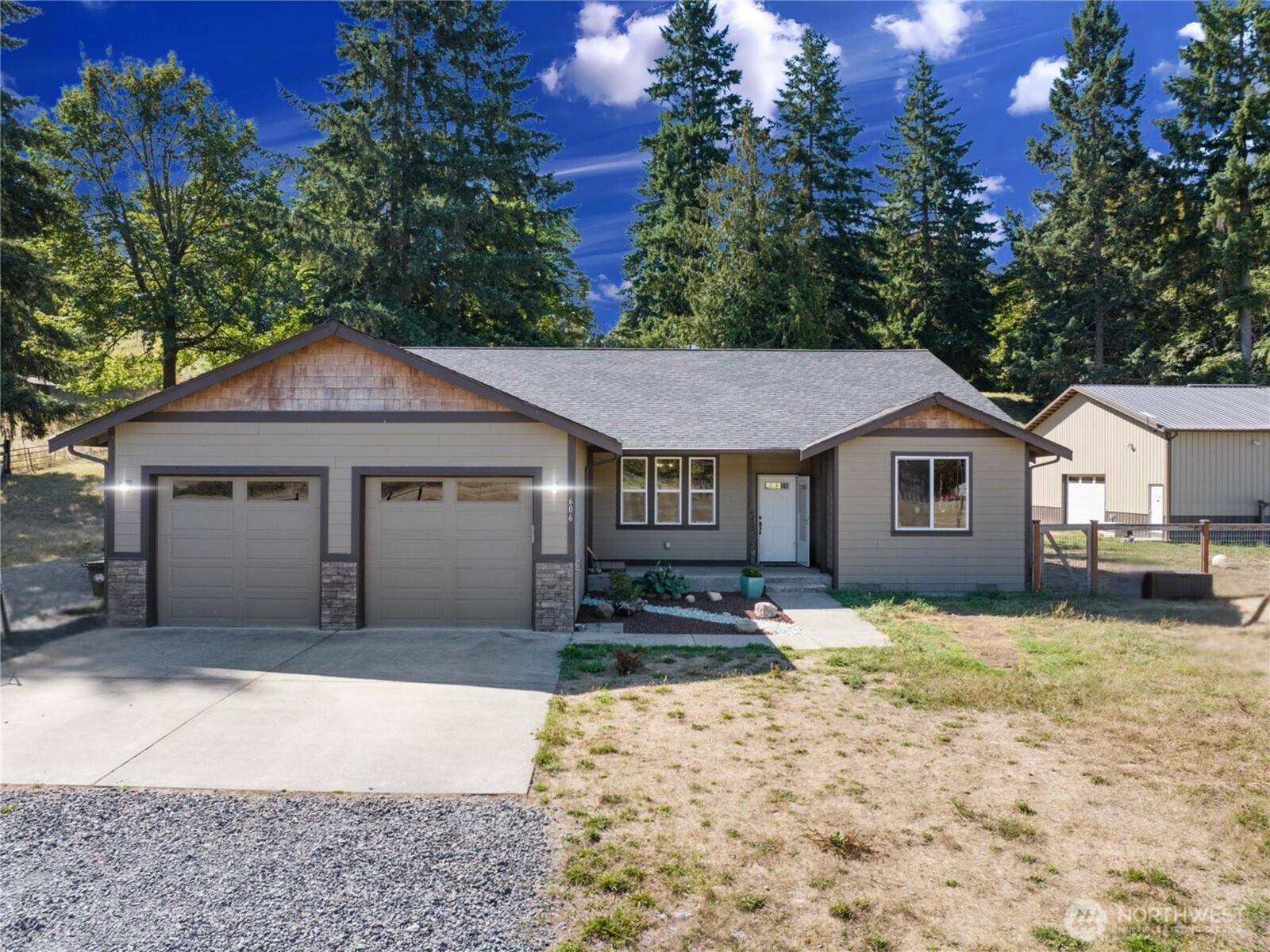 606 288th Street East Roy, WA 98580 - Photo 37 of 37 a front view of a house with a yard covered in snow