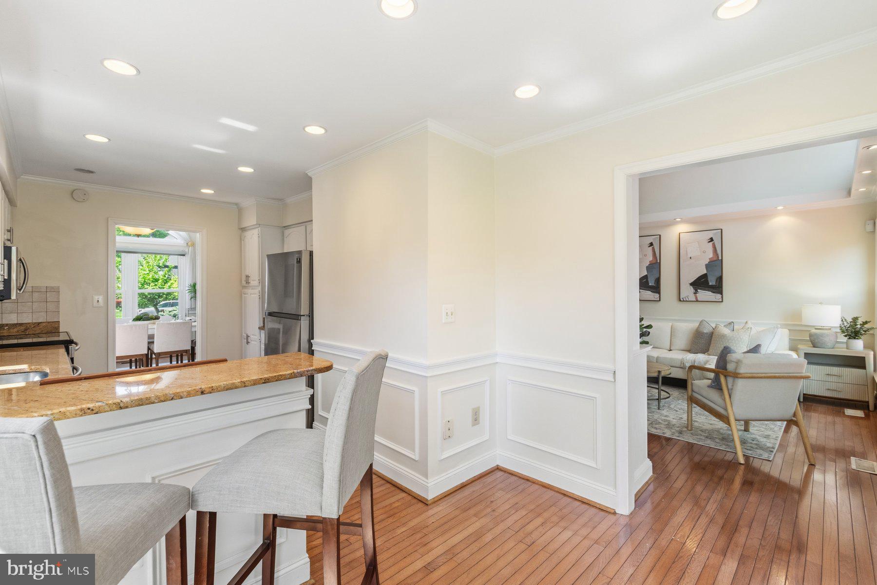 14215 Greenview Drive Laurel, MD 20708 - Photo 14 of 35 a view of a dining room with furniture window and wooden floor