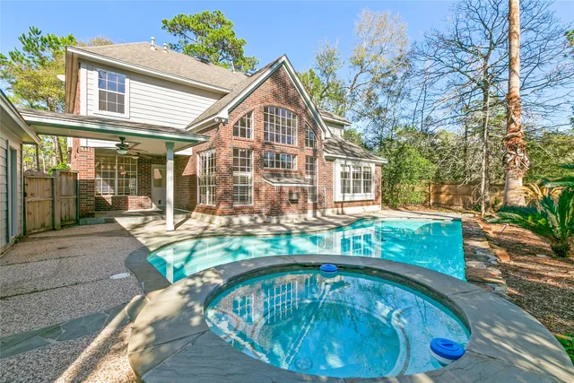 a front view of house with yard outdoor seating and barbeque oven