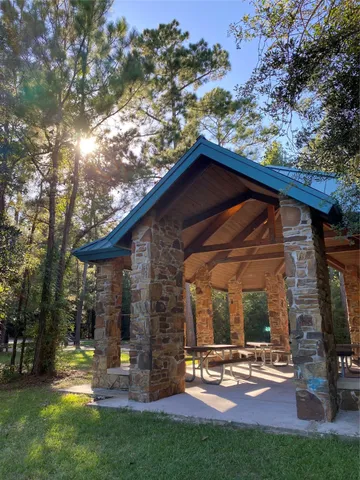 a view of a two chairs in the backyard