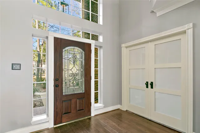 a view of front door with wooden floor