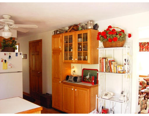 49 Upper Hampden Road Monson, MA 01057 - Photo 8 of 16 a bedroom with a bed and a refrigerator