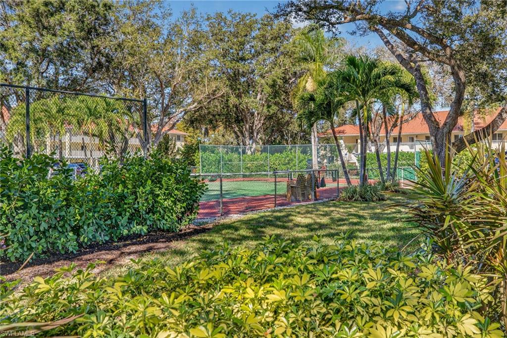 3665 Amberly Circle, Unit B101 Naples, FL 34112 - Photo 27 of 30 a view of a park with large trees