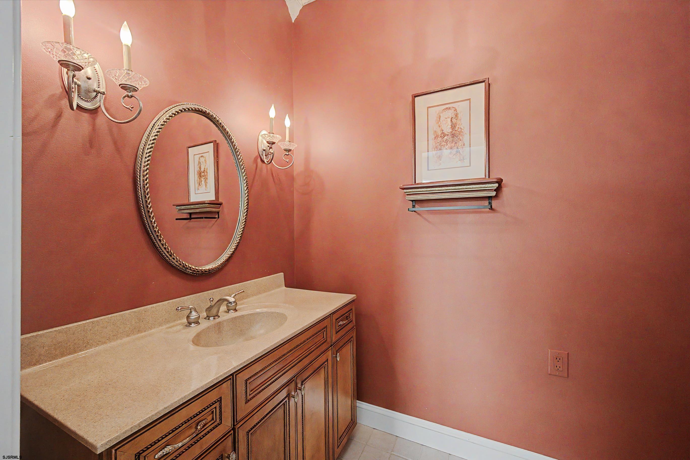 212 17th Street South Brigantine, NJ 08203 - Photo 20 of 37 a bathroom with a sink and a mirror