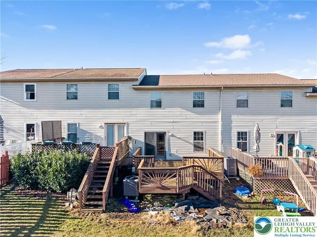 a view of multiple houses with deck