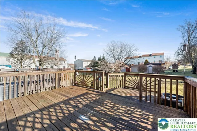 a view of a balcony with wooden floor