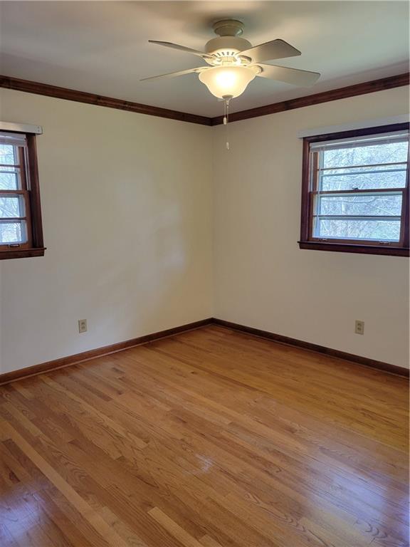 3009 Caldwell Road Northeast Brookhaven, GA 30319 - Photo 11 of 22 a view of an empty room with a window and wooden floor