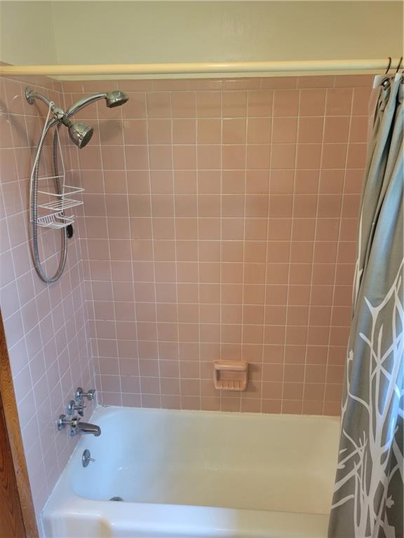 3009 Caldwell Road Northeast Brookhaven, GA 30319 - Photo 13 of 22 a bathroom with a bathtub and a shower