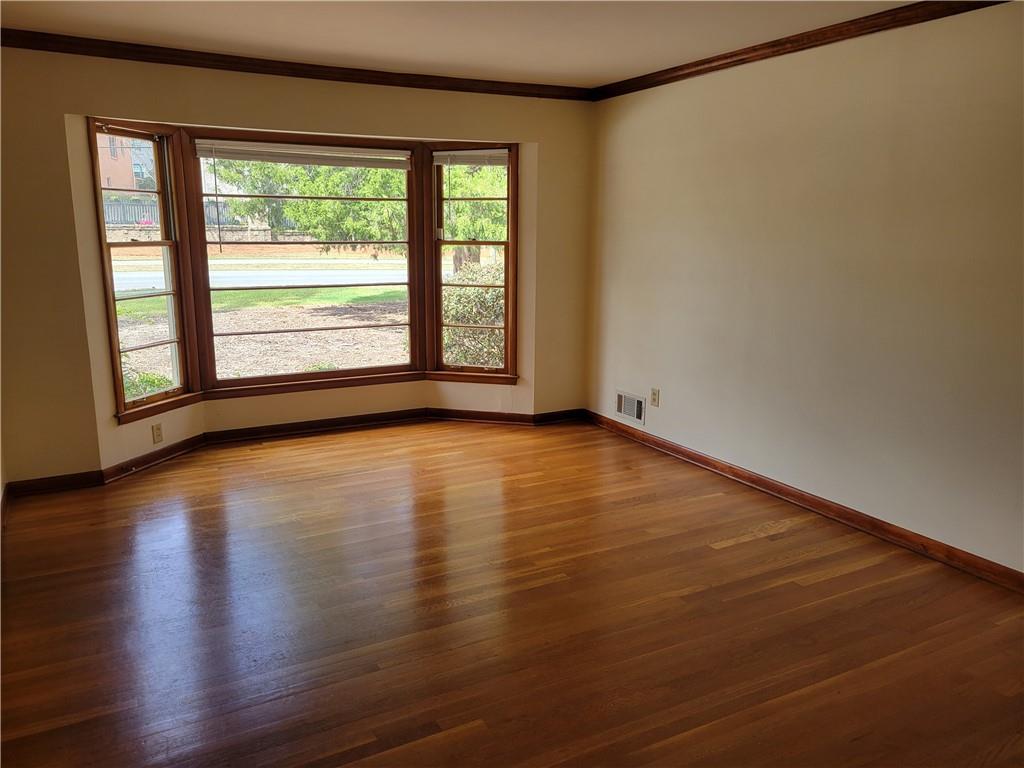 3009 Caldwell Road Northeast Brookhaven, GA 30319 - Photo 7 of 22 a view of room with window and wooden floor