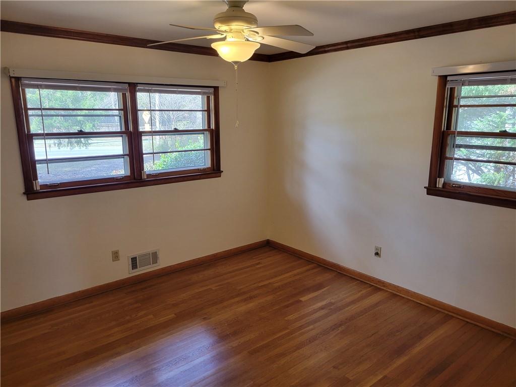 3009 Caldwell Road Northeast Brookhaven, GA 30319 - Photo 10 of 22 a view of empty room with wooden floor and fan
