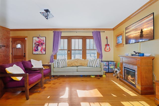 102 Northgate Road Riverside, IL 60546 - Photo 4 of 45 a living room with furniture a rug and a floor to ceiling window