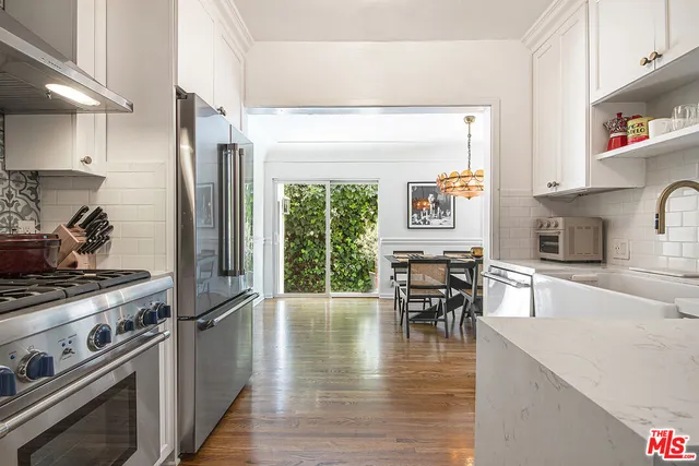 a bedroom with a bed and a table