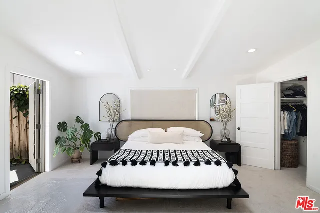 a bathroom with a double vanity sink mirror and bathtub