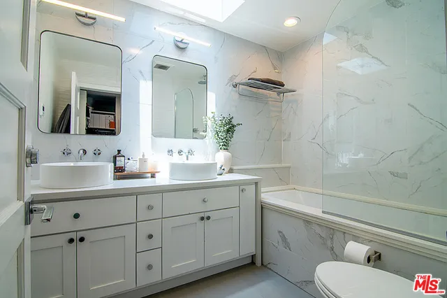 a view of balcony and patio with furniture